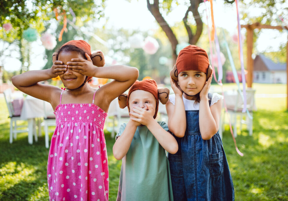 Small,Children,With,Masks,Outdoors,On,Garden,Party,In,Summer,